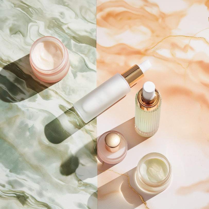 Collage of skincare products on a marble surface